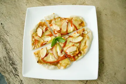 Homemade Mini pizza with apples, onions and peppers